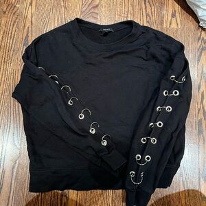 Black sweater with rings